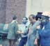 Attica Guards with Gas Masks Escort Man