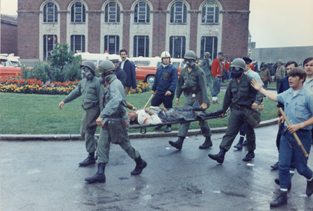 AG_cops w_man on stretcher copy